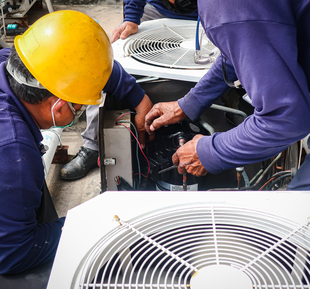 Technicians troubleshooting an HVAC system